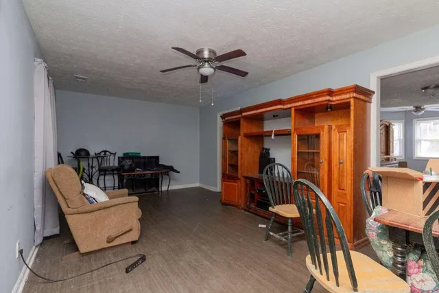 a bedroom with furniture and a window