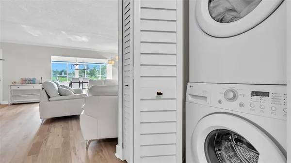 a view of livingroom with washer and dryer