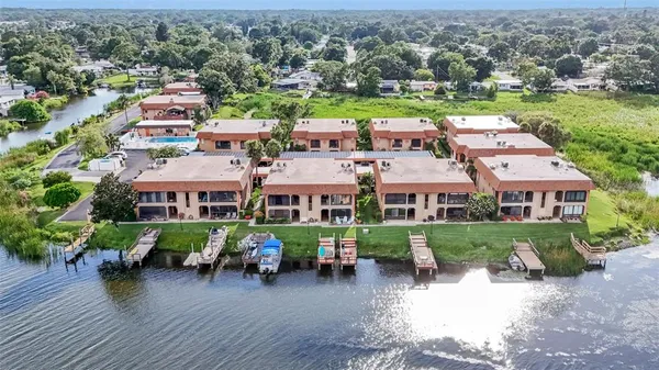 a view of a lake with houses in the back