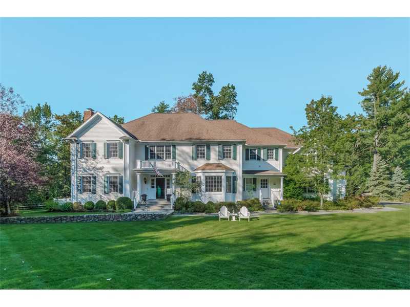 141 Brookside Road Darien, CT 06820 - Photo 1 of 26 a front view of a house with a garden