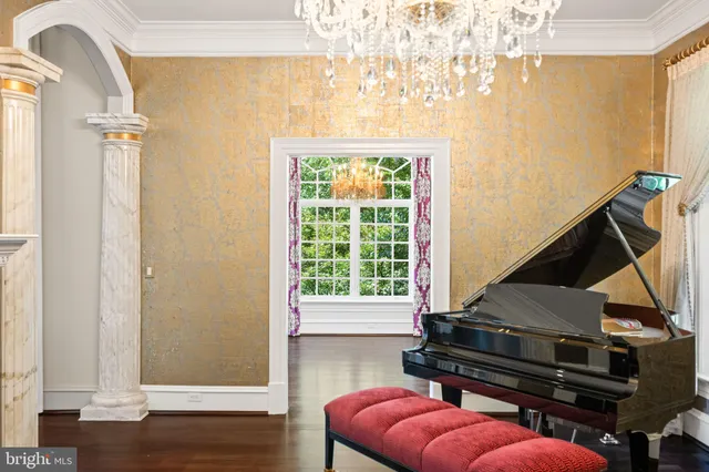 a dining room with furniture a chandelier and a rug
