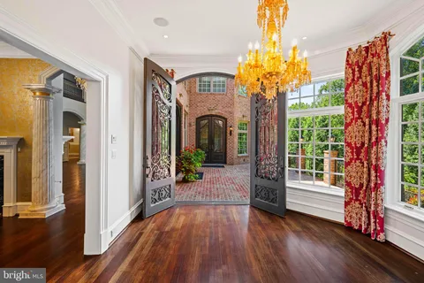 a kitchen with stainless steel appliances a stove a sink and cabinets