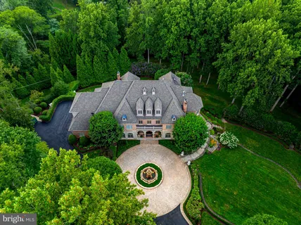 an aerial view of a house with garden space and street view