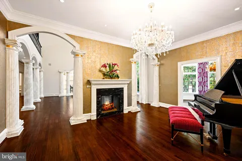 a kitchen with a window and chairs