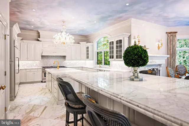a spacious bathroom with a large tub sink and large window