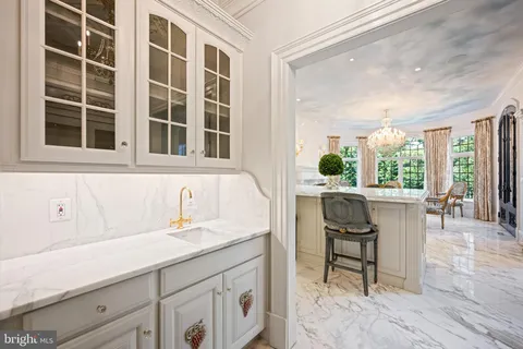 front view of a house with swimming pool and a garden