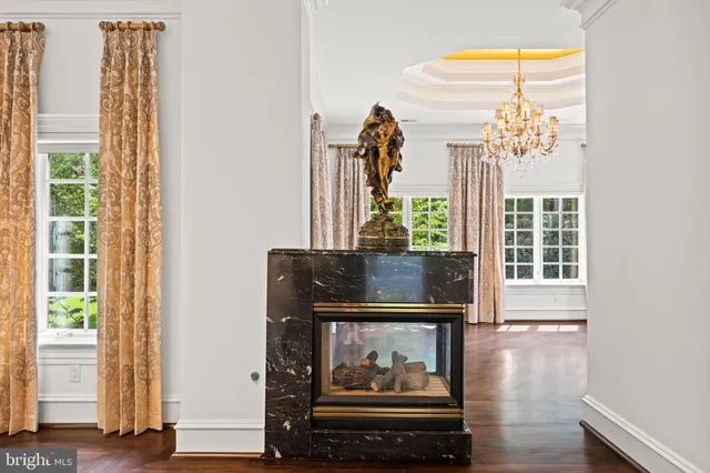 a view of a dining room with furniture and a fireplace