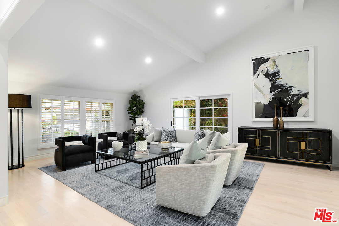 9653 Wendover Drive Beverly Hills, CA 90210 - Photo 11 of 34 a living room with furniture large window and flat screen tv