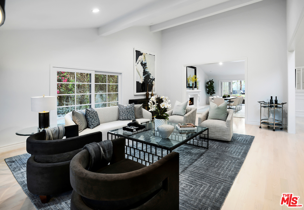 9653 Wendover Drive Beverly Hills, CA 90210 - Photo 12 of 34 a living room with furniture and a large window