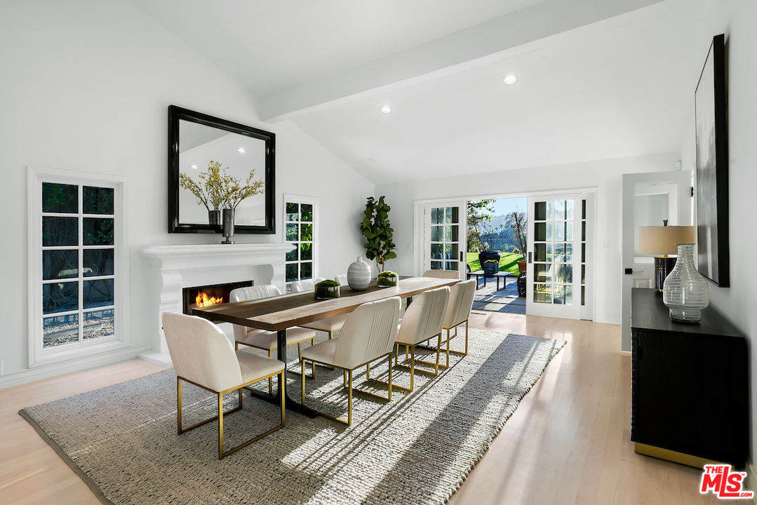 9653 Wendover Drive Beverly Hills, CA 90210 - Photo 15 of 34 a view of a dining room with furniture window and wooden floor