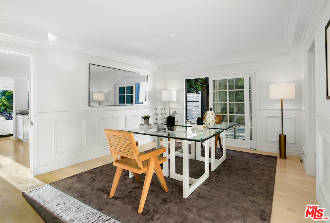 9653 Wendover Drive Beverly Hills, CA 90210 - Photo 16 of 34 a view of a dining room with furniture and a potted plant