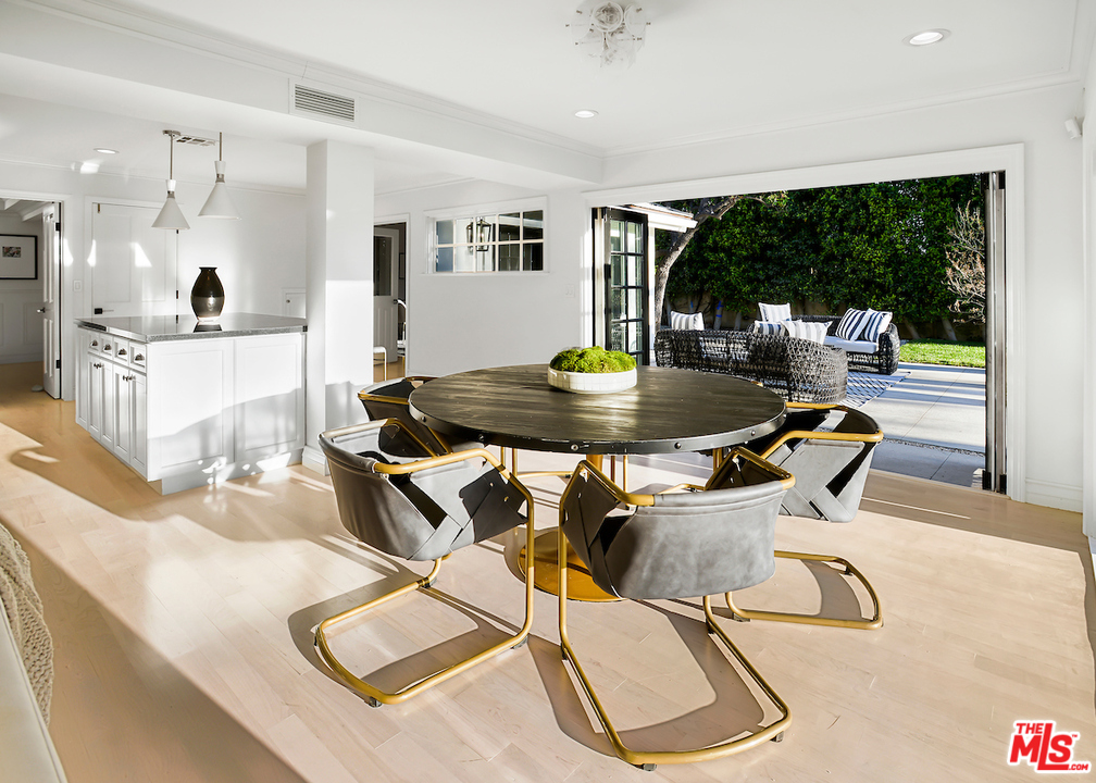 9653 Wendover Drive Beverly Hills, CA 90210 - Photo 21 of 34 a kitchen with dining table and chairs
