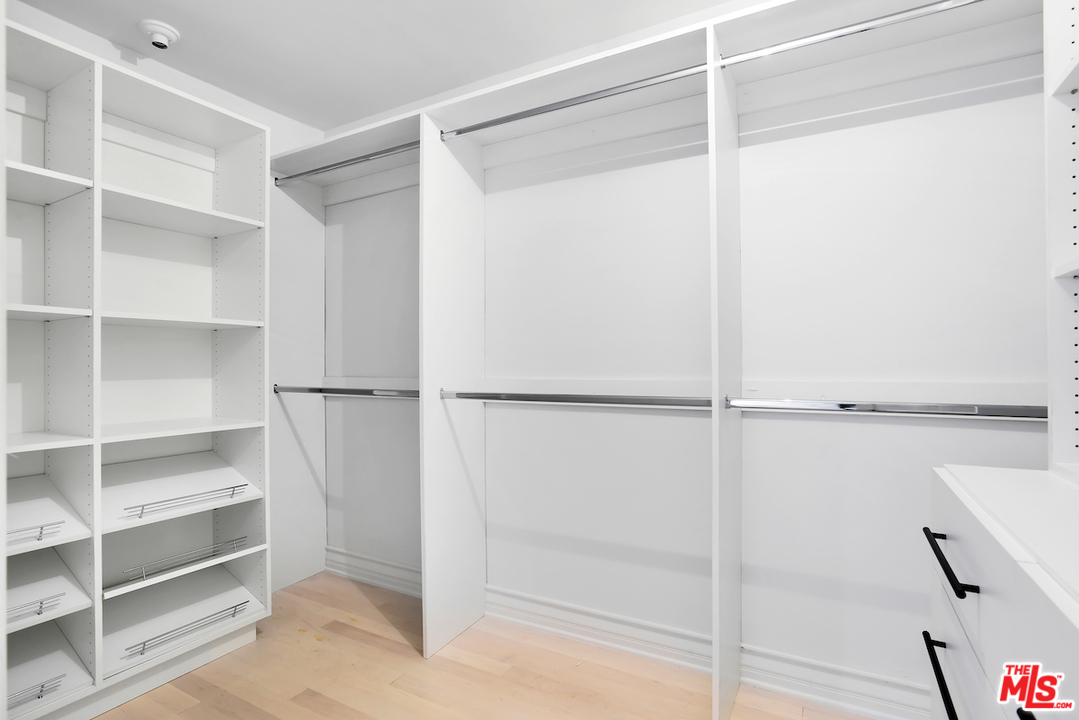 9653 Wendover Drive Beverly Hills, CA 90210 - Photo 28 of 34 a view of walk in closet with empty racks