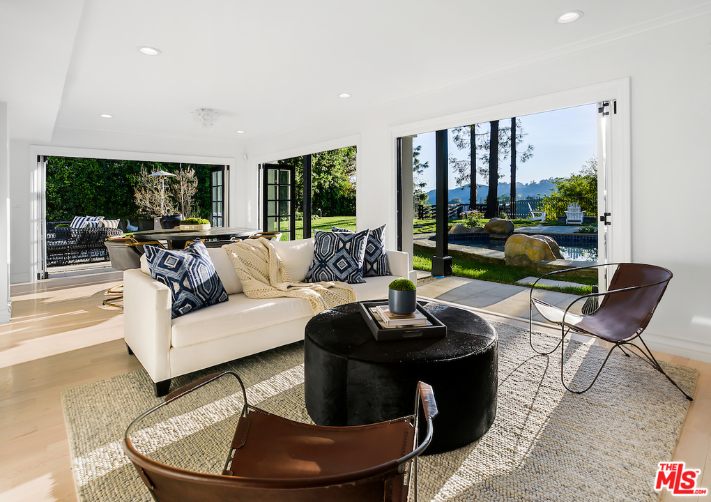 9653 Wendover Drive Beverly Hills, CA 90210 - Photo 4 of 34 a living room with furniture and a large window