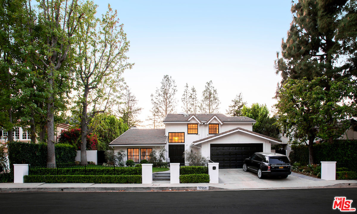 9653 Wendover Drive Beverly Hills, CA 90210 - Photo 6 of 34 a car parked in front of a house next to a yard