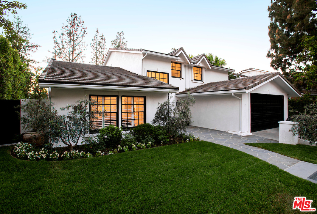9653 Wendover Drive Beverly Hills, CA 90210 - Photo 8 of 34 a front view of a house with a garden and plants