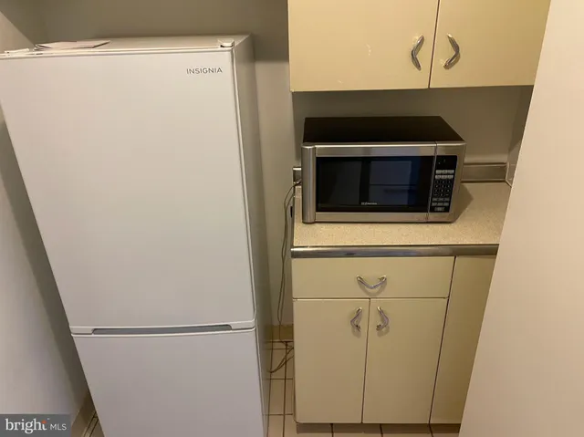 a kitchen with a stove and a refrigerator