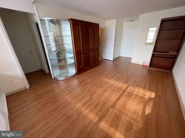 a view of an empty room and a hallway