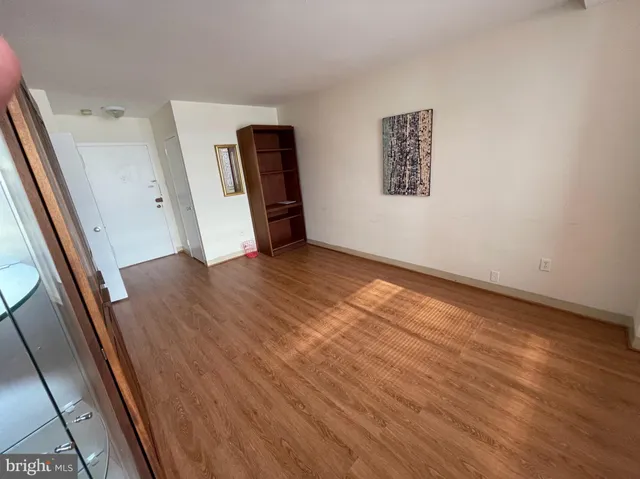 a white toilet sitting next to a small sink