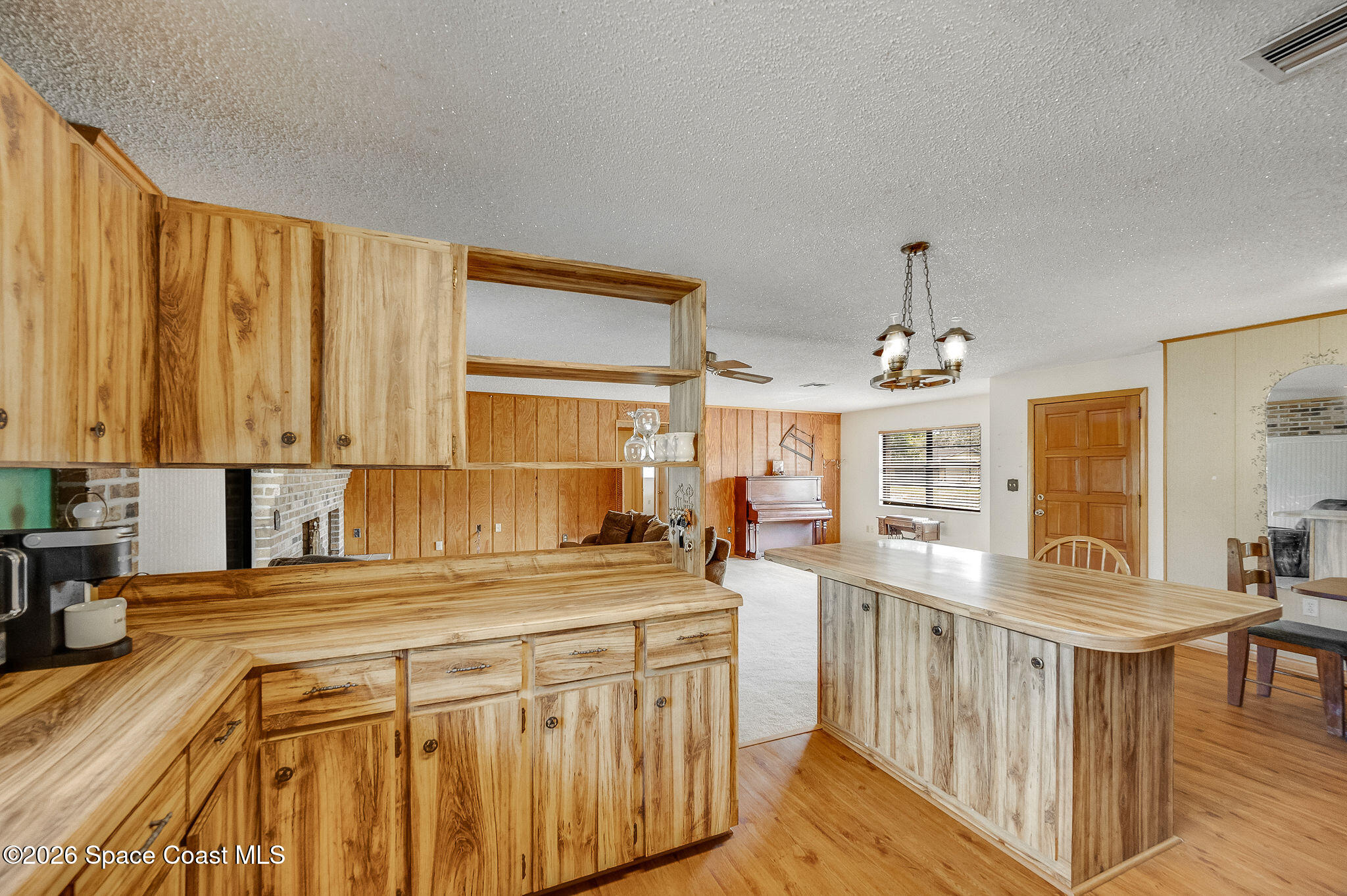 4600 Janet Road Cocoa, FL 32926 - Photo 12 of 50 a kitchen with stainless steel appliances granite countertop a sink a stove cabinets counter space and a window