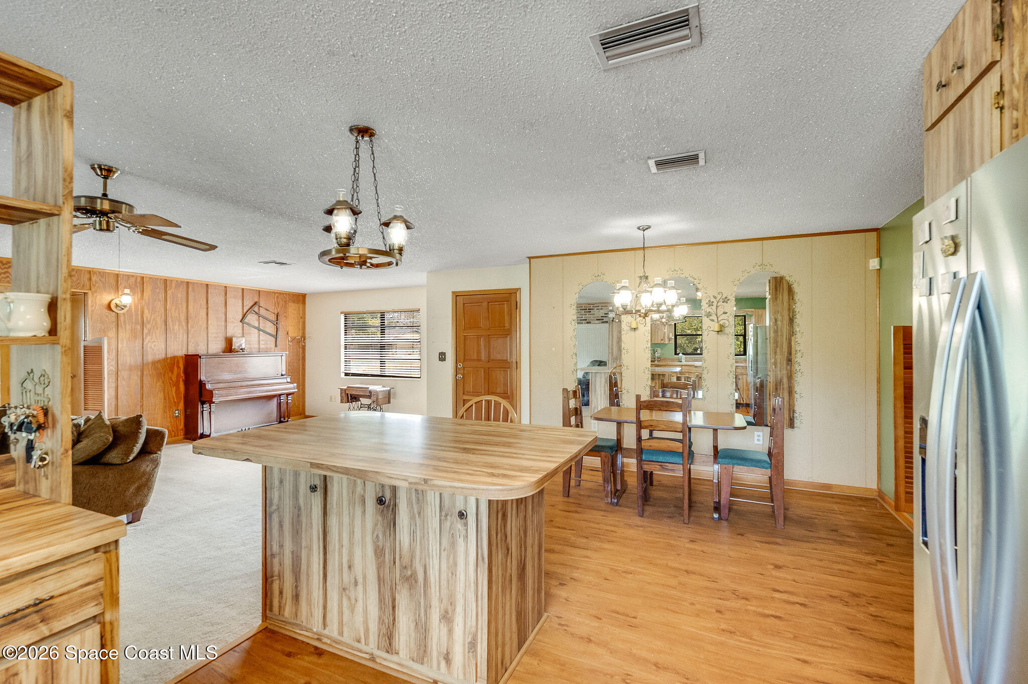4600 Janet Road Cocoa, FL 32926 - Photo 13 of 50 a view of a dining room with furniture window and wooden floor