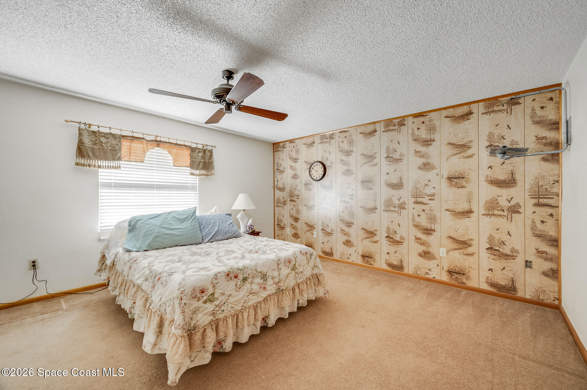 4600 Janet Road Cocoa, FL 32926 - Photo 19 of 50 a bedroom with a bed and a window