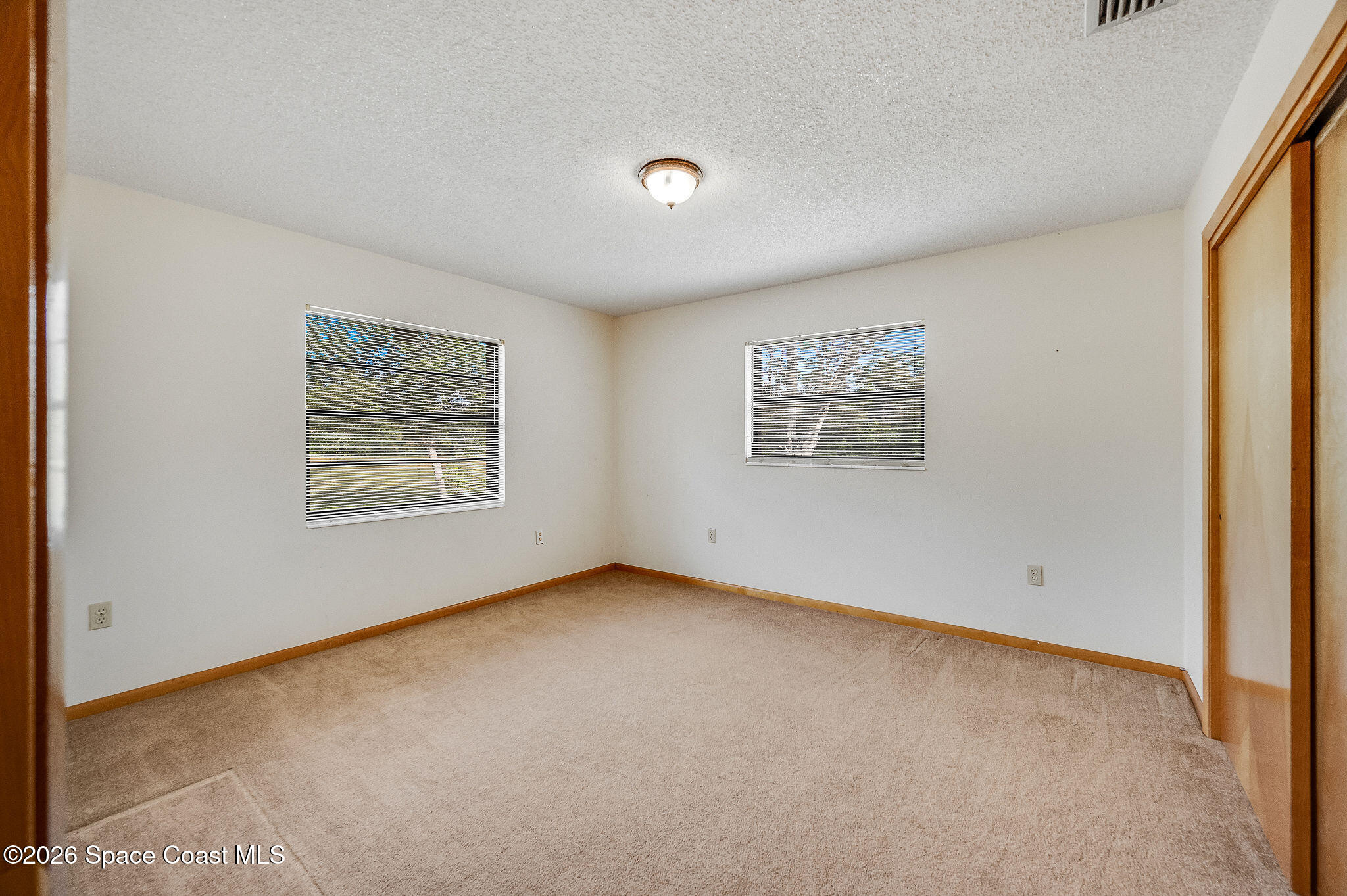 4600 Janet Road Cocoa, FL 32926 - Photo 25 of 50 an empty room with a window
