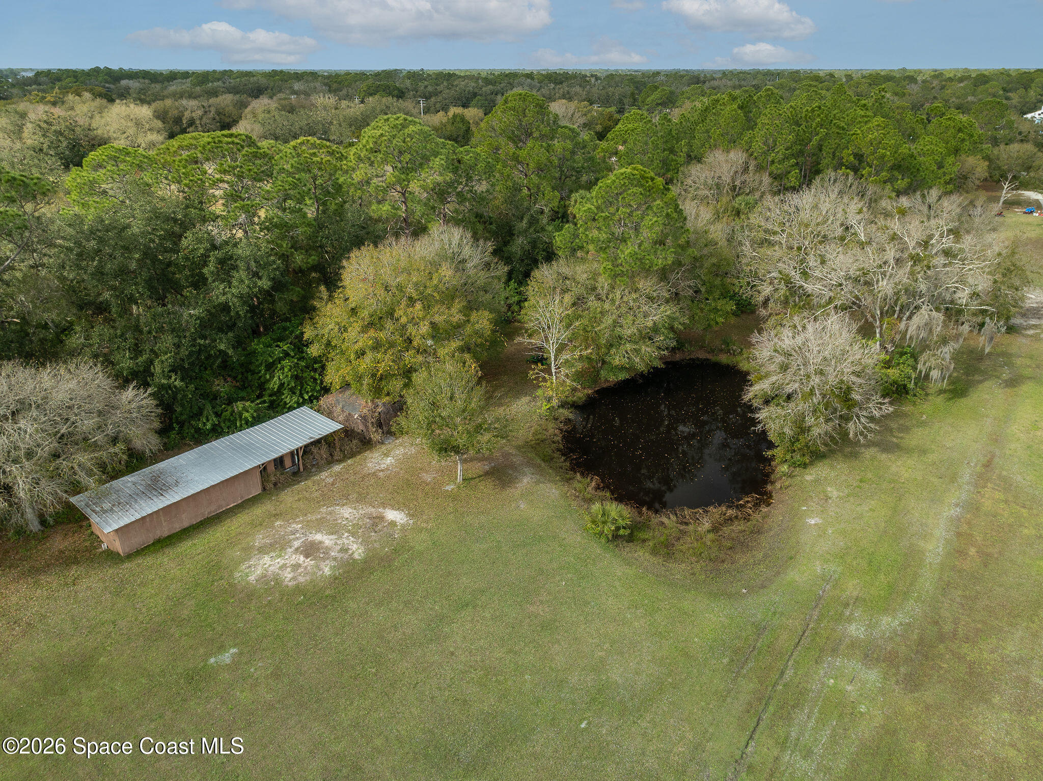 4600 Janet Road Cocoa, FL 32926 - Photo 36 of 50 a view of a back yard from a balcony