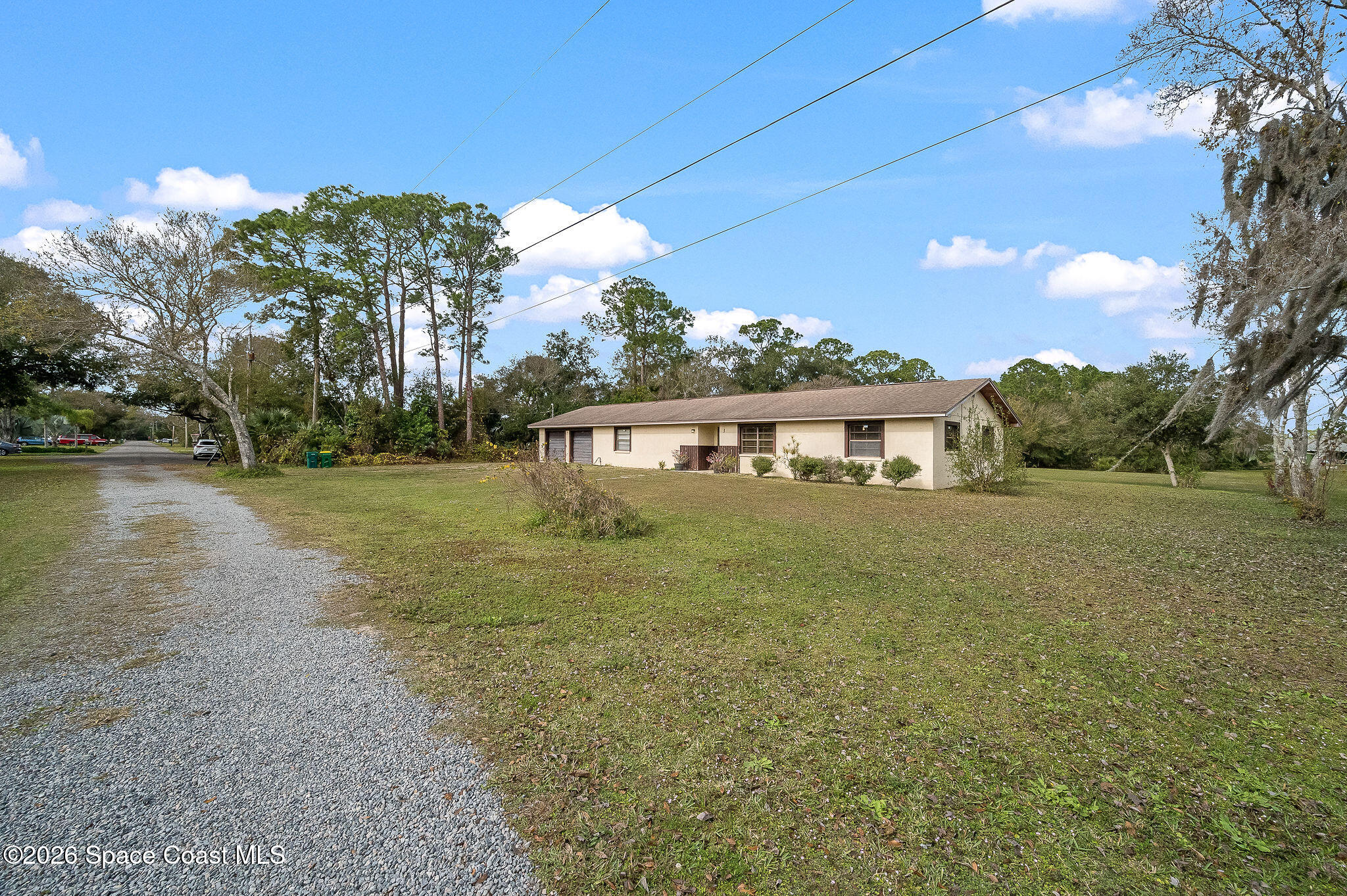4600 Janet Road Cocoa, FL 32926 - Photo 41 of 50 a front view of a house with a yard