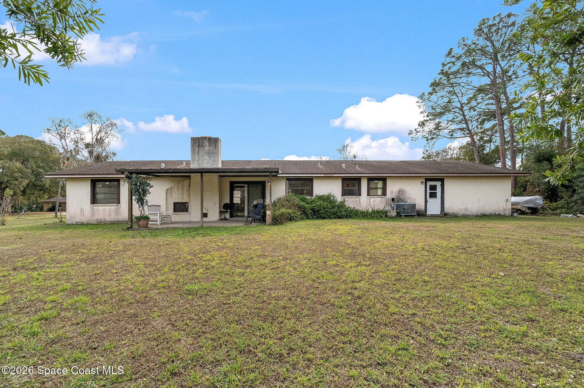 4600 Janet Road Cocoa, FL 32926 - Photo 45 of 50 a front view of a house with a garden