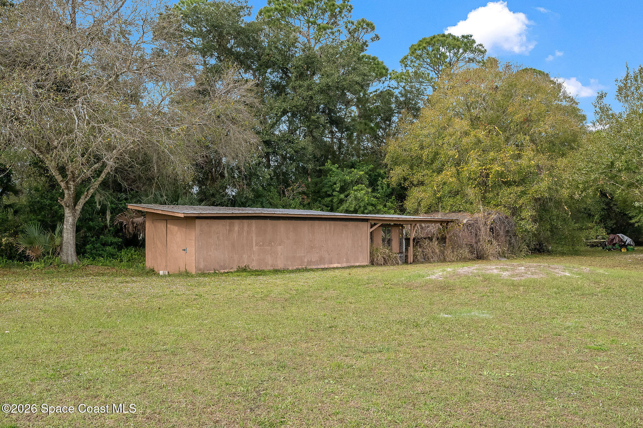 4600 Janet Road Cocoa, FL 32926 - Photo 47 of 50 a front view of a house with a yard