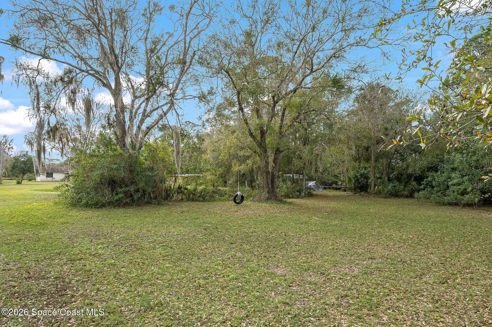 4600 Janet Road Cocoa, FL 32926 - Photo 49 of 50 a view of a field with trees in front of it