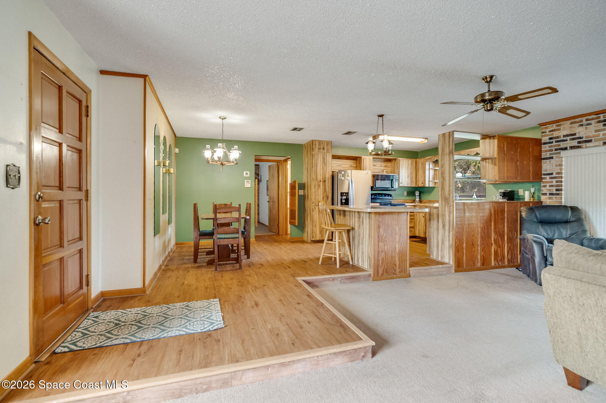 4600 Janet Road Cocoa, FL 32926 - Photo 5 of 50 a kitchen with stainless steel appliances kitchen island granite countertop a refrigerator and a sink