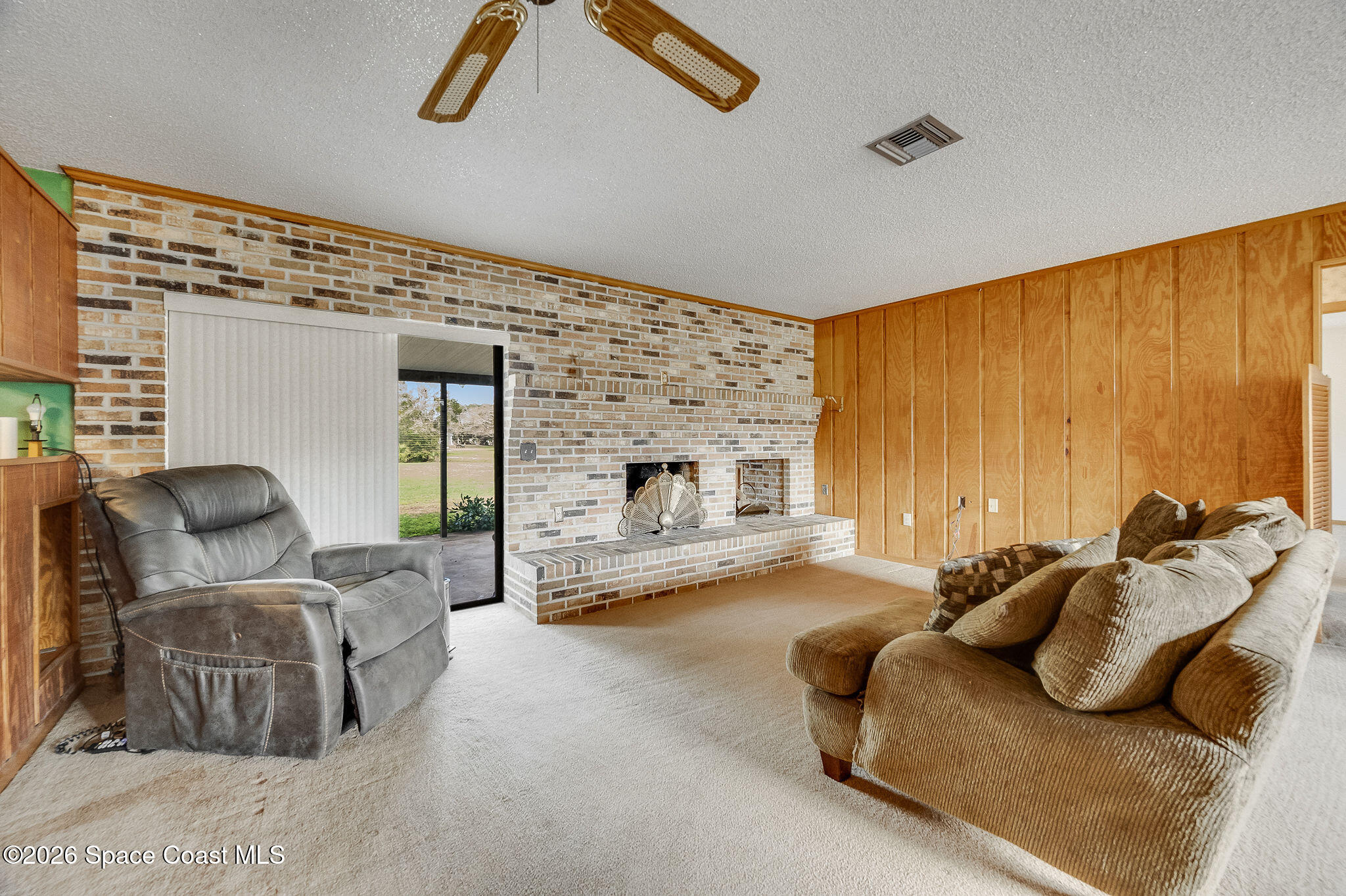 4600 Janet Road Cocoa, FL 32926 - Photo 6 of 50 a bedroom with furniture and a fireplace