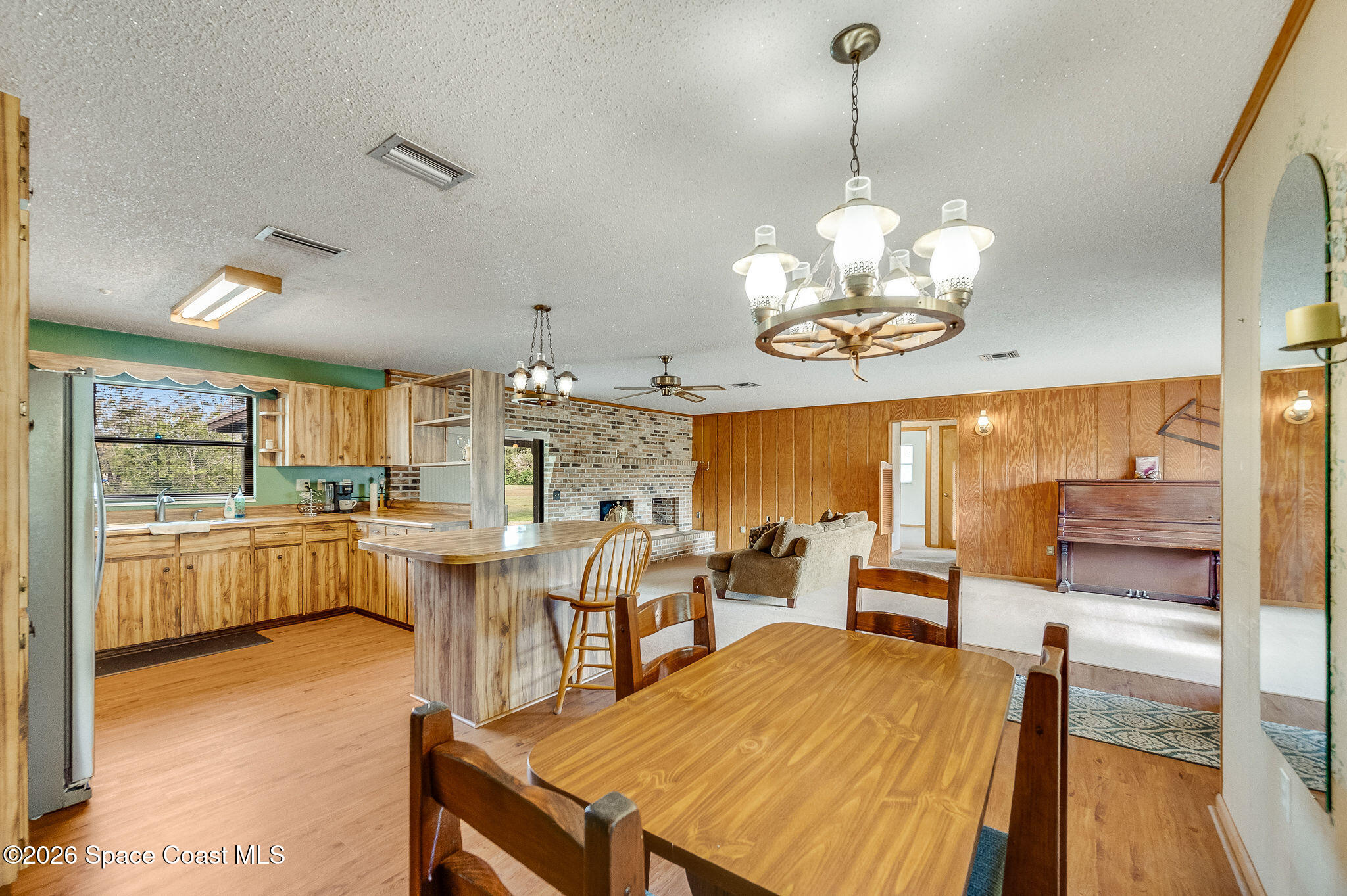 4600 Janet Road Cocoa, FL 32926 - Photo 8 of 50 a large kitchen with a table and chairs