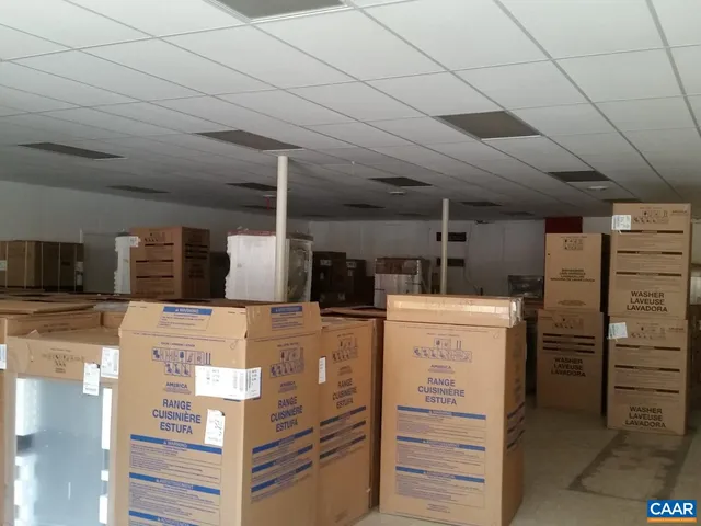 a kitchen with refrigerator and cabinets