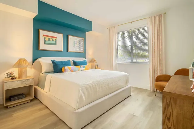 a bedroom with bed and window