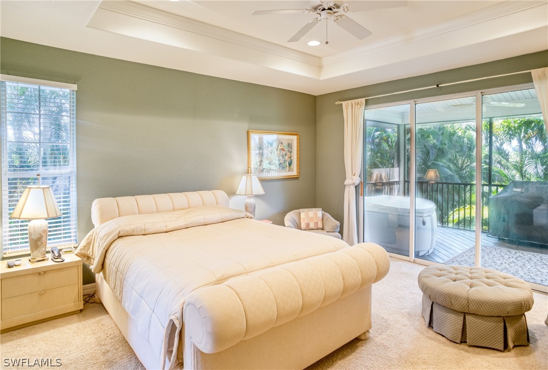 1585 Sand Castle Road Sanibel, FL 33957 - Photo 8 of 34 a bedroom with a bed and a large window