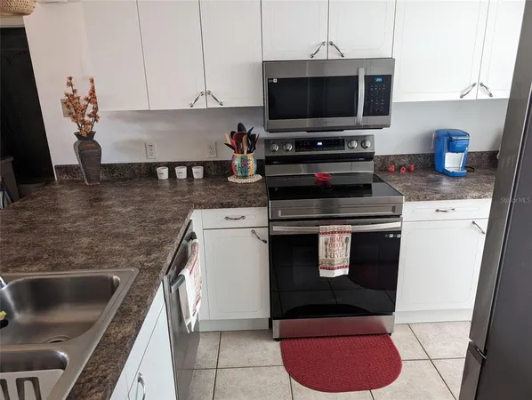 a kitchen with a stove and a microwave