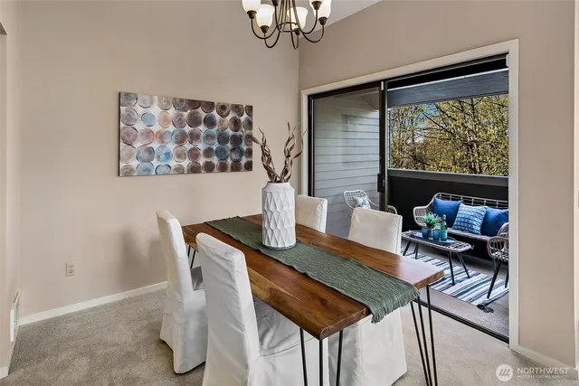 a view of a dining room with furniture window and outside view