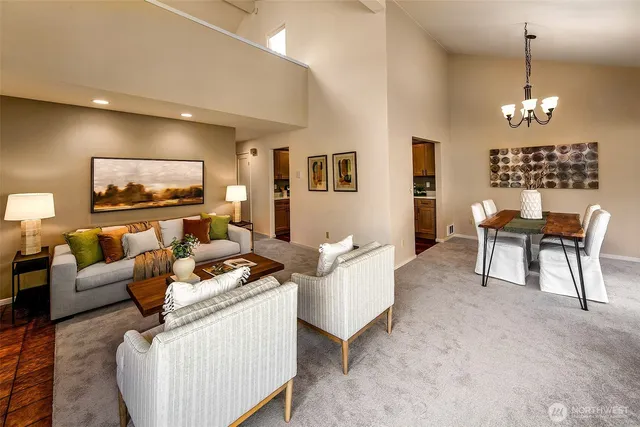 a view of a hallway with wooden floor and workspace