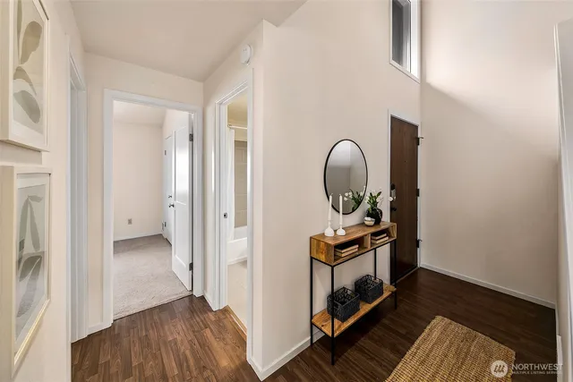 a bedroom with a bed and a painting on the wall