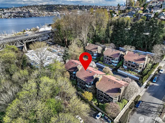 an aerial view of a house with lake view