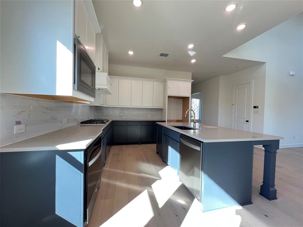 15625 Hawks Pass Road Frisco, TX 75035 - Photo 12 of 27 a kitchen with a sink cabinets and window