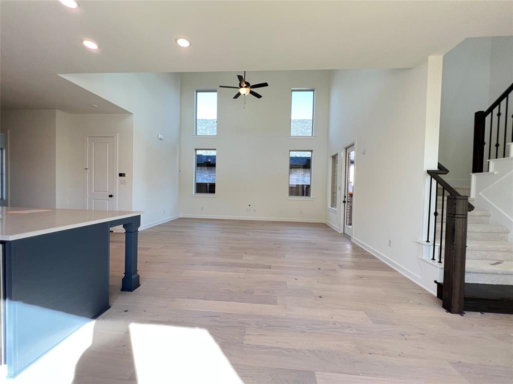 15625 Hawks Pass Road Frisco, TX 75035 - Photo 13 of 27 wooden floor in an empty room with a window