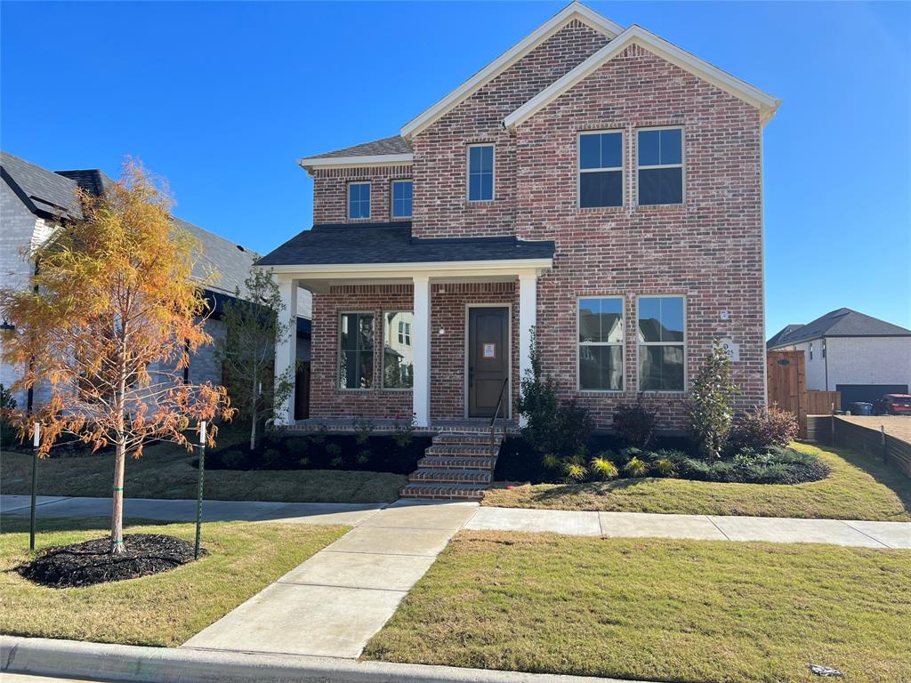 15625 Hawks Pass Road Frisco, TX 75035 - Photo 2 of 27 a front view of a house with garden