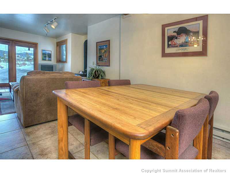 875 4 O Clock Road, Unit 2 Breckenridge, CO 80424 - Photo 7 of 13 a dining room with a table and chairs