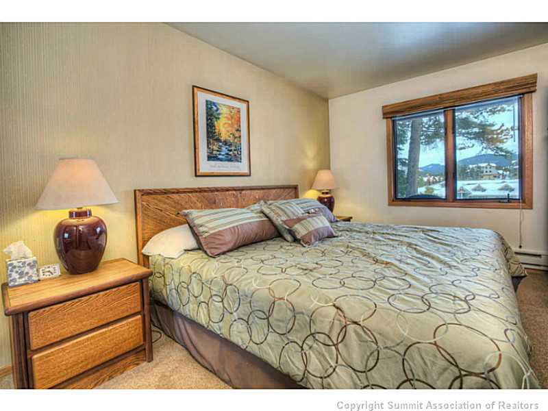 875 4 O Clock Road, Unit 2 Breckenridge, CO 80424 - Photo 9 of 13 a bedroom with a bed and window
