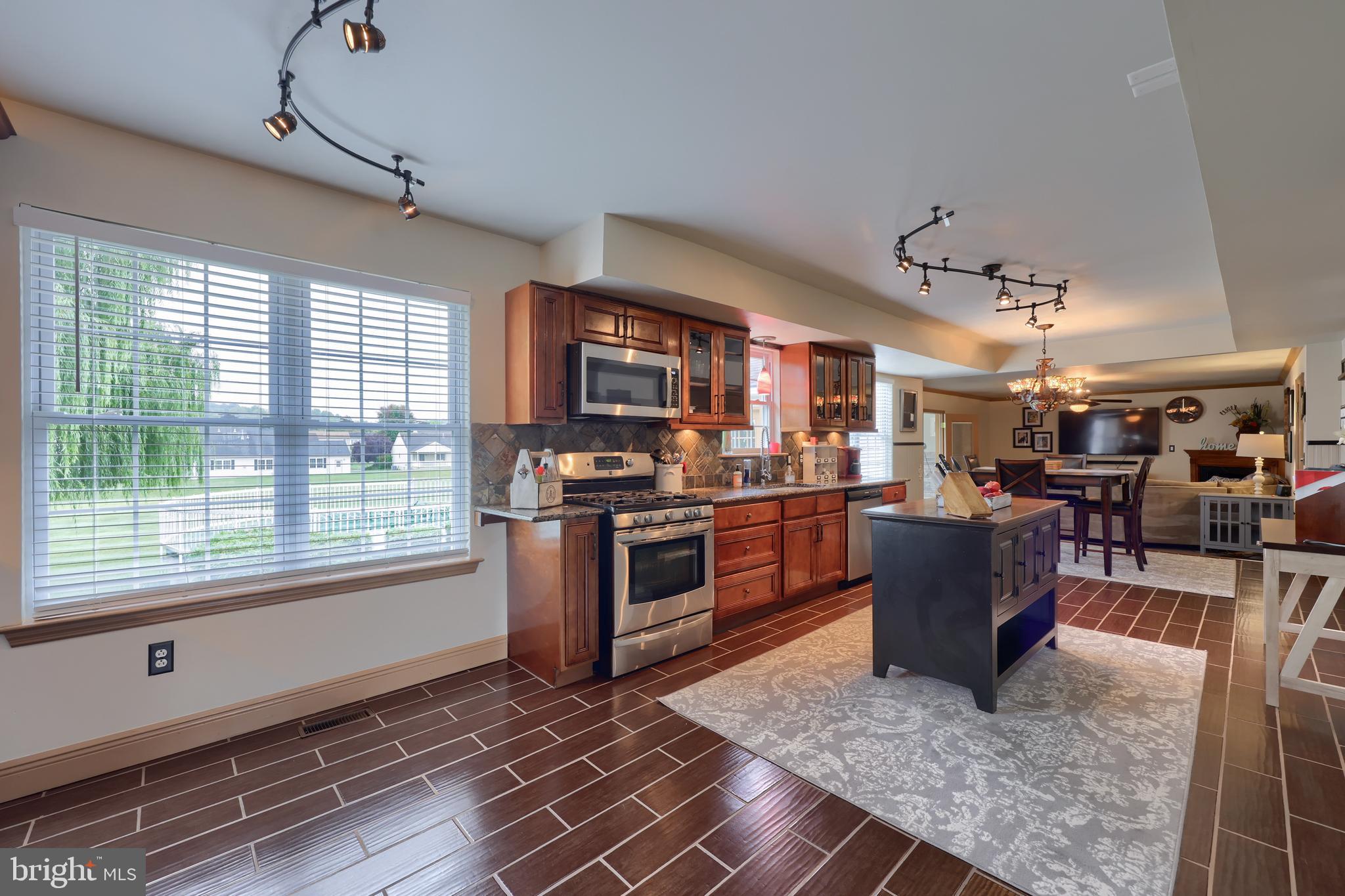 100 Roxberry Drive Reading, PA 19608 - Photo 12 of 46 a kitchen with stainless steel appliances granite countertop a stove and a refrigerator