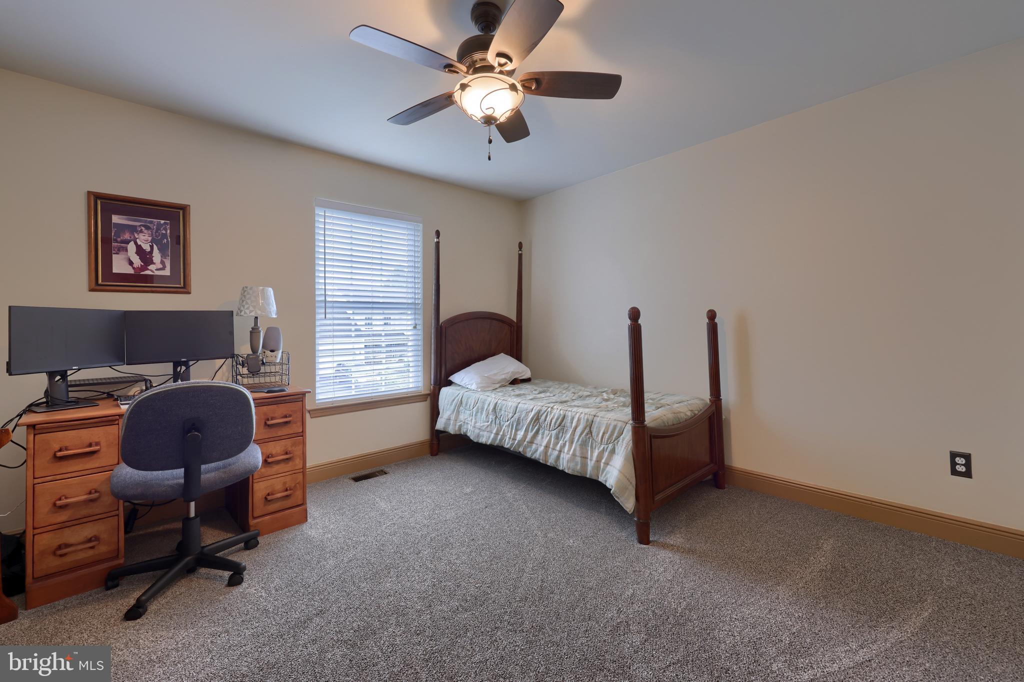 100 Roxberry Drive Reading, PA 19608 - Photo 31 of 46 a bedroom with bed and a chandelier fan